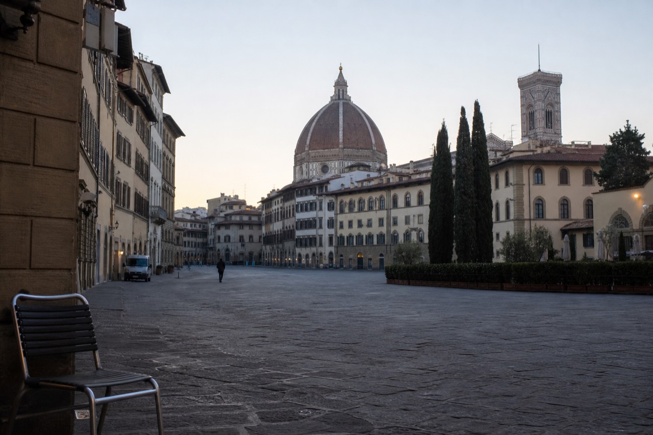 The Duomo of Florence with its brick dome rising above the rooftops of the historic centre