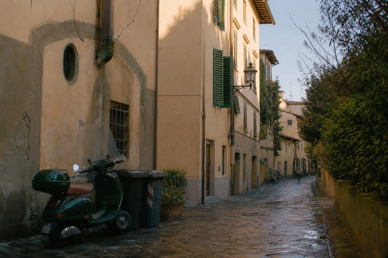 A quiet Florentine residential street with ochre shutters and parked bicycles in morning light